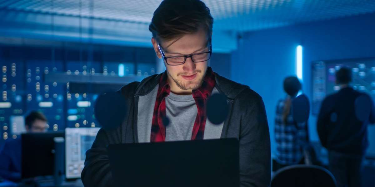 cyber security worker reviewing cyber recovery solution